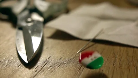Super slow motion shot of falling and bouncing Italian flag button. Made in Stock Footage 70583104