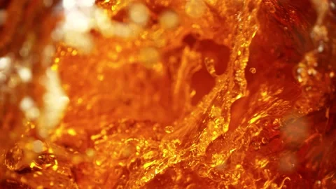 Super Slow Motion Shot of Falling Ice Cubes into Golden Liquid Vortex at 1000 Stock Footage 132368516