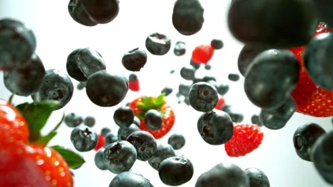 Super slow motion shot of falling and rotating berries Stock Footage 258435802