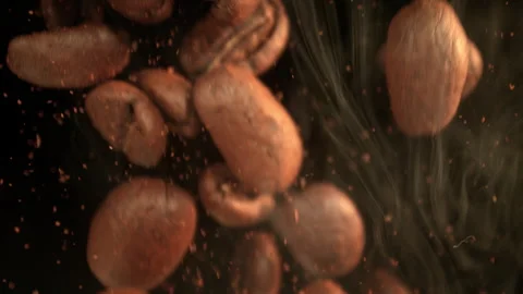 Super Slow Motion Shot of Falling Coffee Beans and Ground Coffee on Black Stock Footage 340003489