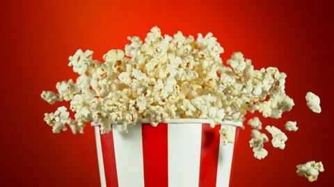 Super Slow Motion Shot of Fluffy Popcorn Exploding from Bucket at 1000fps. Stock Footage 262491644