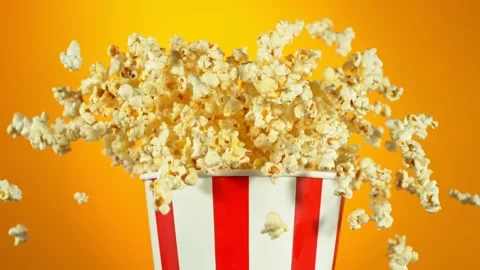 Super Slow Motion Shot of Fluffy Flavoured Popcorn Exploding from Bucket at Stock Footage 263106093