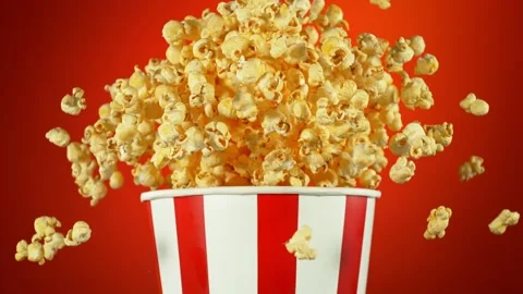 Super Slow Motion Shot of Fluffy Flavoured Popcorn Exploding from Bucket at Stock Footage 266141737