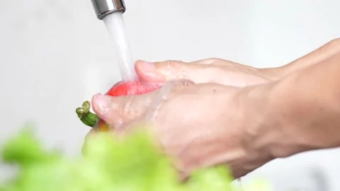 Super Slow Motion Shot of Flying Cuts of Colorful Vegetables and Water Stock Footage 131314885