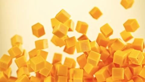 Super Slow Motion Shot of Flying Cheddar Cheese Cubes at 1000 fps. Video stock 141548556
