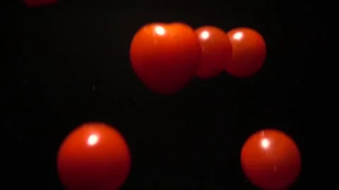 Super Slow Motion Shot of Flying Cherry Tomatoes, Collision in the Air Stock Footage 254519910