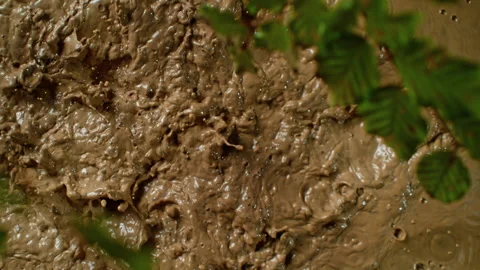 Super Slow Motion Shot of Flying and Splashing Mud in Nature at 1000fps. Stock Footage 326922958