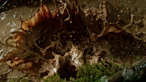 Super Slow Motion Shot of Flying and Splashing Mud in Nature at 1000fps. Stock Footage 327692485