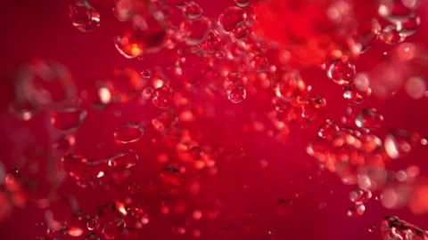 Super Slow Motion Shot of Flying Red Lemonade Liquid Drops at 1000fps. Stock Footage 329077336