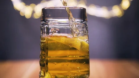 Super slow motion shot, fresh beer with bubbles and lemon Stock Footage 128700987
