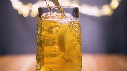 Super slow motion shot, fresh beer with bubbles and lemon Stock Footage 128701367