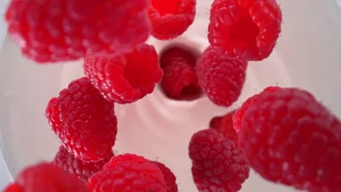Super Slow Motion Shot of Fresh Raspberries Followed by Camera Falling into Stock Footage 274705913