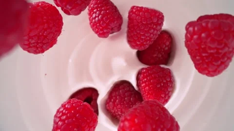 Super Slow Motion Shot of Fresh Raspberries Followed by Camera Falling into Stock Footage 275013160