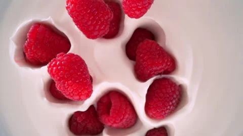 Super Slow Motion Shot of Fresh Raspberries Followed by Camera Falling into Stock Footage 275431550