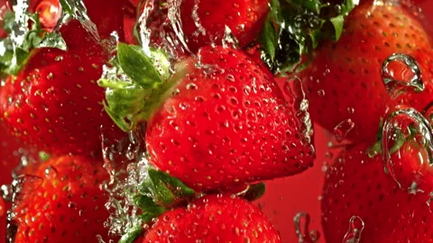 Super Slow Motion Shot of Fresh Strawberries Falling into Water at 1000fps. Stock Footage 341833650