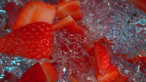 Super Slow Motion Shot of Fresh Strawberries Falling into Water at 1000fps. Stock Footage 341834430