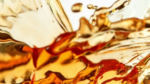 Super Slow Motion Shot of Ice Tea Splash Isolated on White Background at 1000fps Stock Footage 125668699