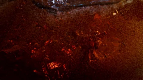 Super Slow Motion Shot of Ice Falling into Fresh Cola Lemonade at 1000fps. Stock Footage 339533766