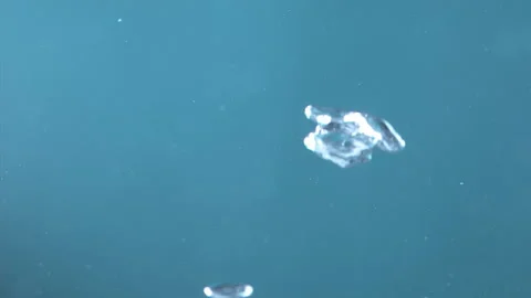 Super Slow Motion Shot of Moving Bubbles on Blue Background  1000fps Stock Footage 270753759