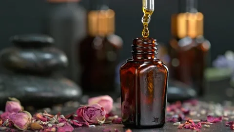 Super Slow Motion Shot of Oily Essence Drop into Phial on Dark Background at Stockbeeldmateriaal 169583602