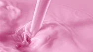 Super Slow Motion Shot Of Pouring And Splashing Strawberry Milk At 1000Fps. Stock Footage