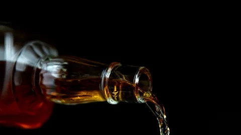 Super Slow Motion Shot of Pouring Whiskey from Bottle at 1000fps with Camera Stock Footage