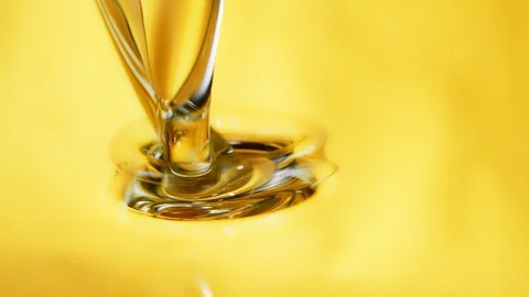 Super Slow Motion Shot of Pouring and Splashing Oil Liquid at 1000fps. Stock Footage 126633663