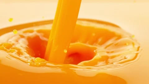 Super Slow Motion Shot of Pouring Fresh Orange Juice at 1000fps. Stock Footage 153173677