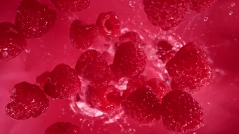 Super Slow Motion Shot of Raspberries Followed by Camera Splashing into Water at Stock Footage 276867623