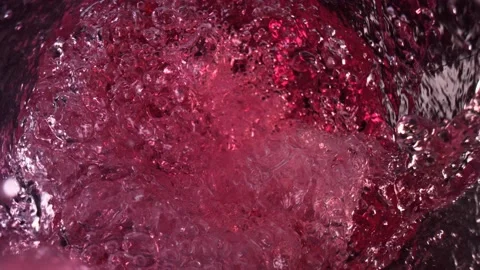 Super Slow Motion Shot of Raspberry Lemonade Whirling and Splashing in Glass Stock Footage 175275894