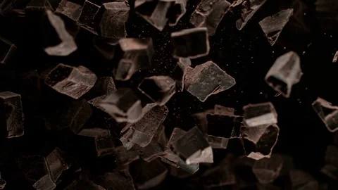 Super Slow Motion Shot of Raw Chocolate Chunks after Being Exploded Towards The Stock Footage 120803829