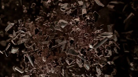 Super Slow Motion Shot of Raw Chocolate Chunks after Being Exploded Towards The Stock Footage 123352997