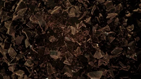 Super Slow Motion Shot of Raw Chocolate Chunks after Being Exploded at 1000fps. Video stock 137033043