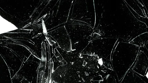 Splitted or broken glass pieces isolated on black background Stock