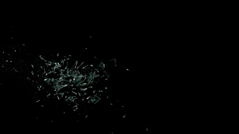 Super Slow Motion Shot of Real Side-Flying Glass Shards Isolated on Black at Stock Footage 323521129