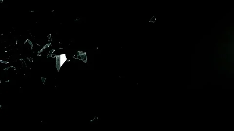 Super Slow Motion Shot of Real Side-Flying Glass Shards Isolated on Black at Stock Footage 326367062