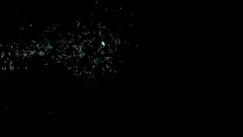 Super Slow Motion Shot of Real Side-Flying Glass Shards Isolated on Black at Stock Footage 327422752