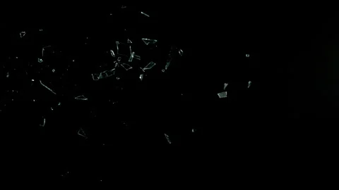 Super Slow Motion Shot of Real Side-Flying Glass Shards Isolated on Black at Stock Footage 328587092