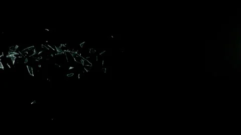 Super Slow Motion Shot of Real Flying Glass Shards on Black at 1000 fps. Stock Footage 330939495