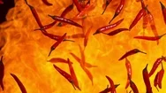 Super Slow Motion Shot Of Red Chilli Peppers And Fire Explosion At 1000Fps. Stock Footage