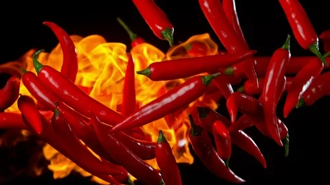 Super Slow Motion Shot of Red Chilli Peppers and fire at 1000fps. Stock Footage 115106896