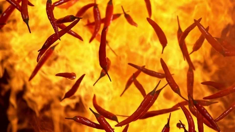 Super Slow Motion Shot of Red Chilli Peppers and Fire Explosion at 1000fps. Stock Footage 115480873