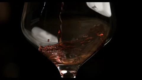 Super Slow Motion Shot Red Wine Pouring in Glass Stock Footage 270409036