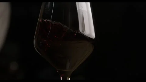 Super Slow Motion Shot of Red Wine Pouring Into a  Glass Stock Footage 270409163