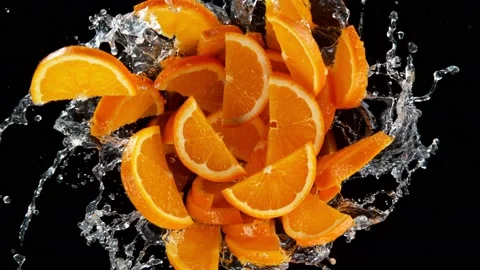 Super slow motion shot of rotating exploded orange slices with splashing water 스톡 동영상 171472216