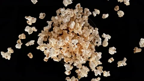 Super slow motion shot of rotating exploded fresh popcorn on black at 1000fps. Stock Footage 171565567