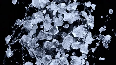 Super slow motion shot of rotating exploded crushed ice and splashing water on Stock Footage 172554447
