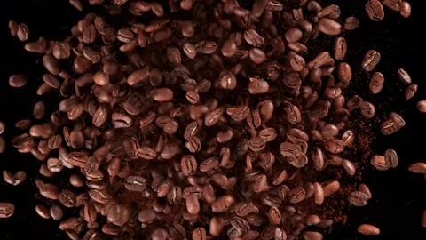 Super Slow Motion Shot of Rotating Coffee Beans and Powder Explosion at 1000fps. Stock Footage 177507759