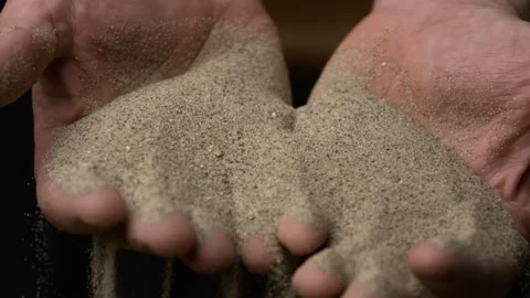 Super Slow Motion Shot of Sand Falling from Hand Stock Footage 270405653