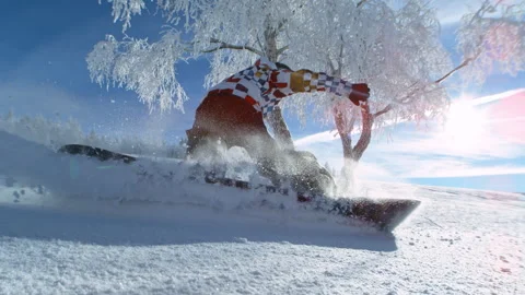 Super Slow Motion Shot of Snowboarder Riding Freeride and Splashing Snow on Stock Footage 297743879